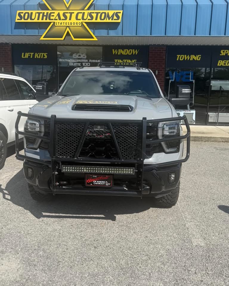 Pickup with a black grille guard and mounted LED light bar
