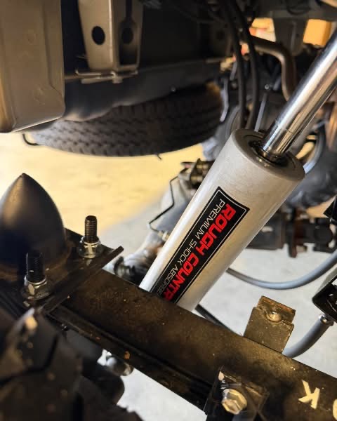Close-up view of a shock absorber installed on a truck